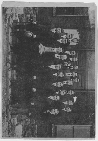 Members of the student branch of the American Institute of Electrical Engineers or of the American Society of Mechanical Engineers stand in front of Mechanical Hall; This image is on page 238 of the 1912 Kentuckian