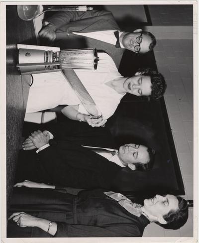 Testing berries; From left to right: Carl Chaplin, Doris Tichenor, Dr. J. C. Rodriguez, and Dr. Abby Marlatt