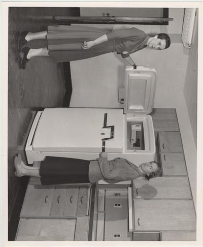 Dr. Abby Marlatt (right), director of the School of Home Economics, and instructor Lois Combs inspect the newly furnished kitchen including the new refrigerator in the Home Economics building