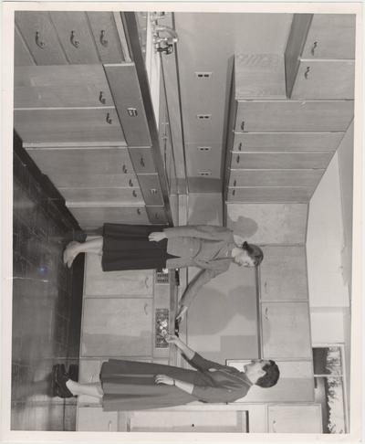 Dr. Abby Marlatt (right), director of the School of Home Economics, and instructor Lois Combs inspect the newly installed liquefied - petroleum - gas range in the Home Economics building