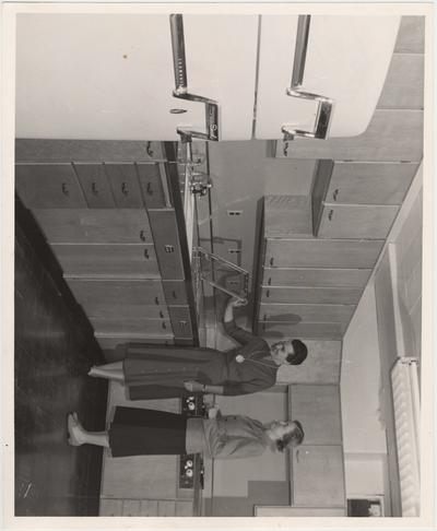 Dr. Abby Marlatt (right), director of the School of Home Economics, and instructor Lois Combs inspect the newly installed liquefied - petroleum - gas range in the Home Economics building