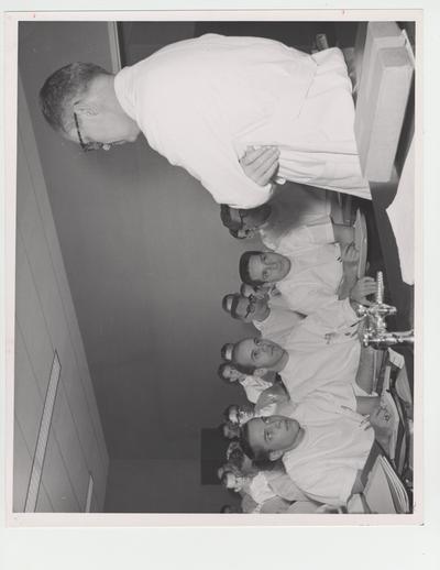 Students listen and take notes during a lecture