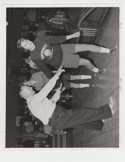 Sergeant Perkins shows two women bowling form