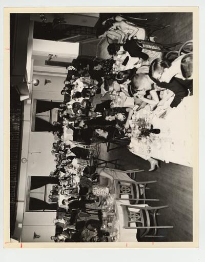 Ashland Junior College Student Awards Banquet; At the speakers table from left to right: 2 unidentified men seated with Clyde Lewis, Lorrain Lewis, Mrs. Shattles, and Mr. Shattles; Location: Henry Clay Hotel