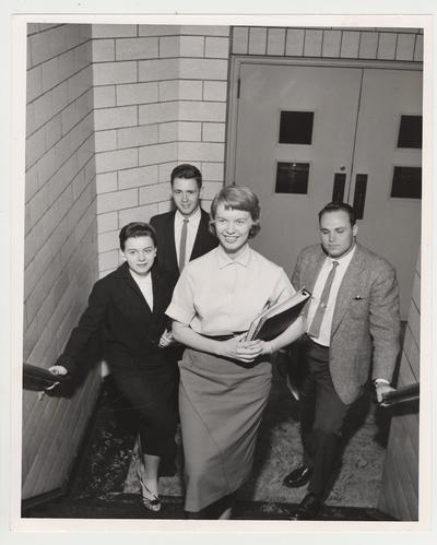 Students in a stairwell include: Sylvia Blythe, Carolyn Ward, and James Grosser