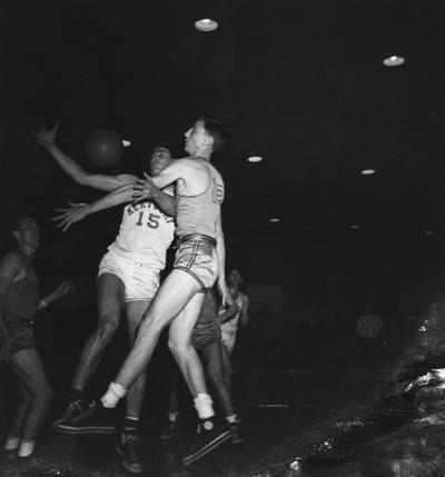 Basketball game action, versus Vanderbilt. Pictured is Alex Groza fighting for the ball