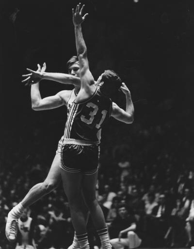 Basketball game action; unidentified UK player passing the ball; photo appears on page 88 in the 1969 Kentuckian