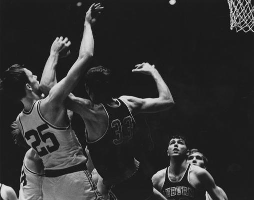 Basketball game action, UK versus Auburn; Larry Steele (25) shoots as other unidentified UK player watches; photo appears on page 386 in the 1969 Kentuckian