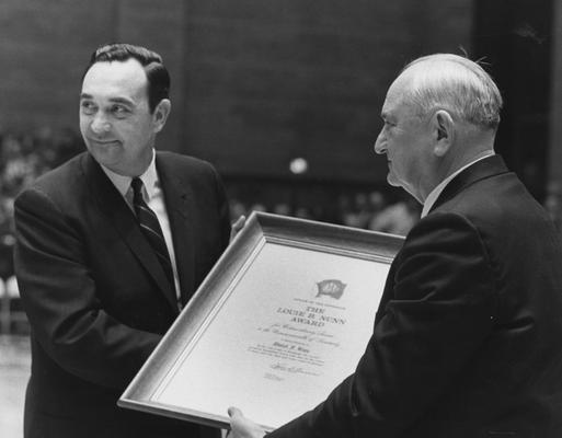 Governor Louis B. Nunn (1967-71) presents basketball coach Adolph Rupp the Louis B. Nunn Award