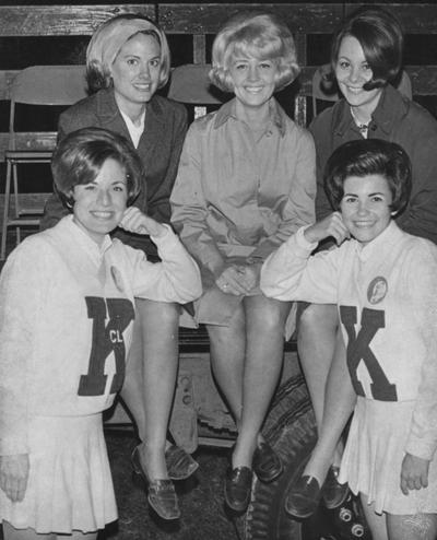Two unidentified cheerleaders and three unidentified students, all homecoming queen finalists