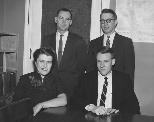 Four UK graduate students receive fellowships; pictured are Joy Neale Query, George Lester (seated), Robert Dowd (standing left) and Raymon Cravens, April 3, 1957; Public Relations photo