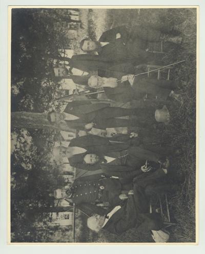 According to the Reference Archivist, this print is the oldest print of the University faculty; Seated, from left to right: Dr. Robert Peter, Physics and Chemistry; President James K. Patterson; unidentified; Professor John Shackleford, professor of English Literature, 1880 - 1889; Standing: Major E. Denning Luxton, commandant of cadets; Professor Francois Helveti, Romance Languages; John A. Dean, superintendent of farm; Professor James G. White, Mathematics, 1869 - 1913, acting President of A & M College, 1910 - 1911