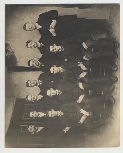 A group of men including Alfred Gay (b. 1871 - d. 1936), who was an assistant in the Academy 1906 - 1911 and listed in the 1887 Board of Trustees minutes