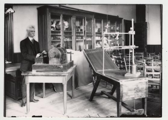 Faculty member Joseph Pryor, shown here, and Merry Pence, together built this early x - ray machine