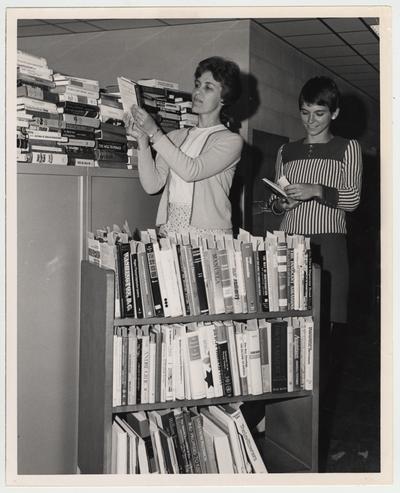University of Kentucky Library staffers Loraine Noel (left) and Judy Boston, begin classification of the library's new books purchased under the Automatic Book Acquisition Program; Photographer: Kalman Papp