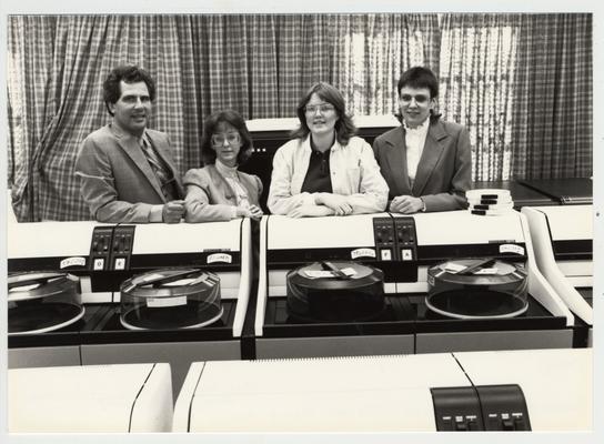 Mike Lach with three unidentified female librarians; Submitted for use the the 1983 / 1984 annual Report