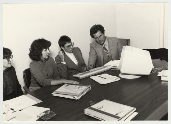 Gail Kennedy (second from left) and Mike Lach sit with two unidentified women; Submitted for use the the 1983 / 1984 annual Report