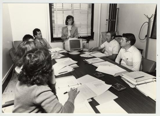 Gail Kennedy (left), Mike Lach (fourth from left) and Phillip Planck (second from right) and Ben Rice (right), of the Computer Center; Submitted for use the the 1983 / 1984 annual Report