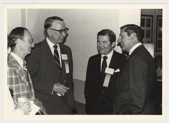 Leonard Press (far left), Director of KET; George Joplin III (second from left); Albert P. Smith, Jr. (second from right), commentator for KET Television Program Comment on Kentucky; and an unidentified man are conversing at the Hillbrook Collection dedication