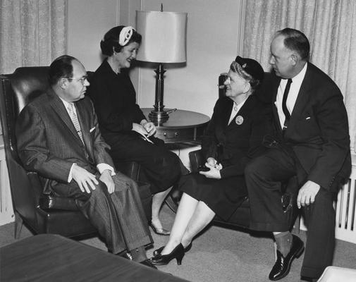 Mr. and Mrs. Lesshaft (left) and Mr. and Mrs. Doughty (right) in the boardroom at Carnahan House; Public Relations photo