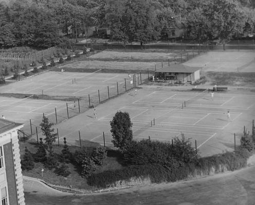 Unidentified people playing on the tennis courts which are located on the corner of Rose Street and Clifton. The current site of the Chemistry and Physics Building