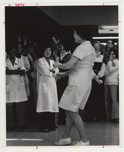 Ruth Goodpastor, a food service worker, dances