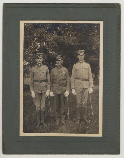 Three men in uniform.  Professor T. R. Bryant, Capt. Phil Corbusier, and Professor H. H. Downing