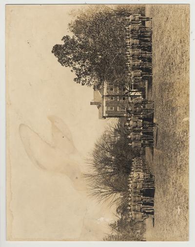 Company in formation, possibly training troops for World War I.  Frazee Hall in the background
