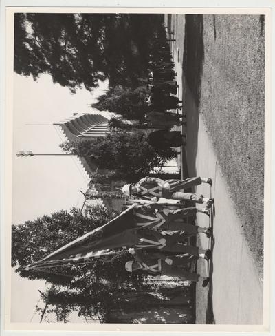 A Reserve Officers Training Corps Color guard detail leading the processional to the ceremonies for President Frank Dickey's inauguration