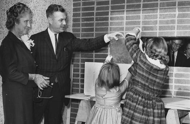 The dedication of Blazer Hall was on October 14, 1962. This photograph is of President Dickey and Mrs. Paul Blazer with her grandchildren, Barrie and Martha. Photo received from the Lexington Herald-Leader