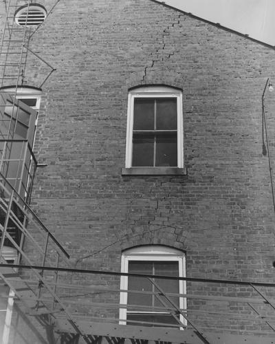 A side of Patterson Hall showing cracks in the bricks. Patterson Hall was completed in 1904 and was named after James K. Patterson. Received June 1, 1959 from Public Relations