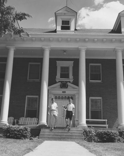 Roy Wood (right) and an unidentified man are in front of the Delta Tau Delta house. Received May 22, 1958 from Public Relations