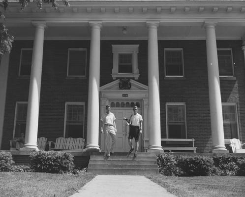 Roy Wood (right) and an unidentified man are in front of the Delta Tau Delta house. Received May 22, 1958 from Public Relations