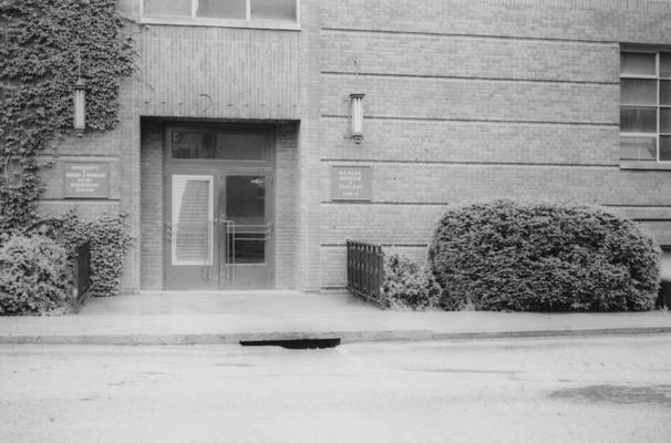 Two signs on the side of the Funkhouser building denoting W. R. Allen Zoology Museum. The Funkhouser building was built in 1940 and named after William D. Funkhouser