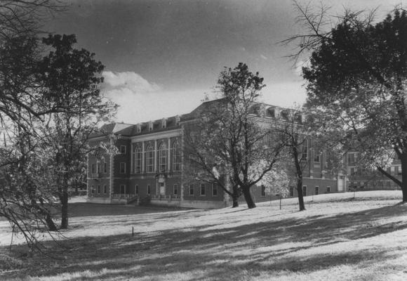Margaret I. King South Library with porch. Porch was destroyed and front lawn filled in when the north wing was built in 1974. Development (central) used this print for a publication