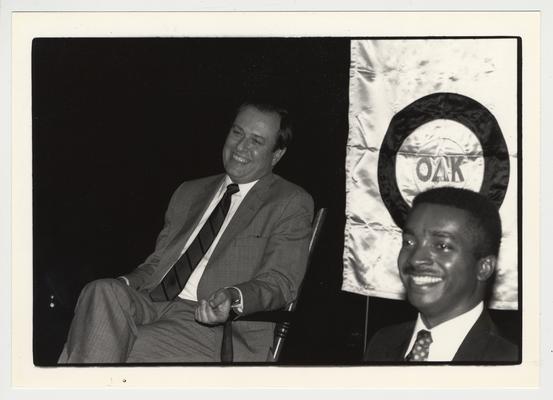 Omicron Delta Kappa presents a chair to President Wethington.  President Wethington is on the left and Adrian Jones is on the right.  Omicron Delta Kappa, Nu circle is a leadership honorary fraternity