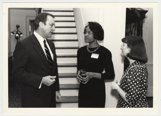President Wethington (left) with an unidentified African-American woman, and Susan West (far right) from the Student Affairs Office