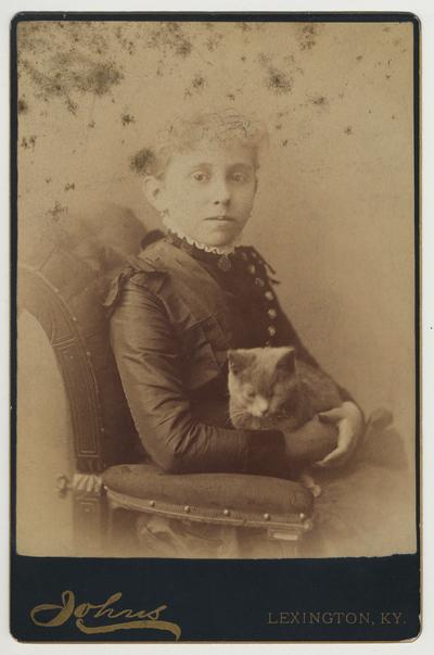 An unidentified female member of James White's family holding a cat