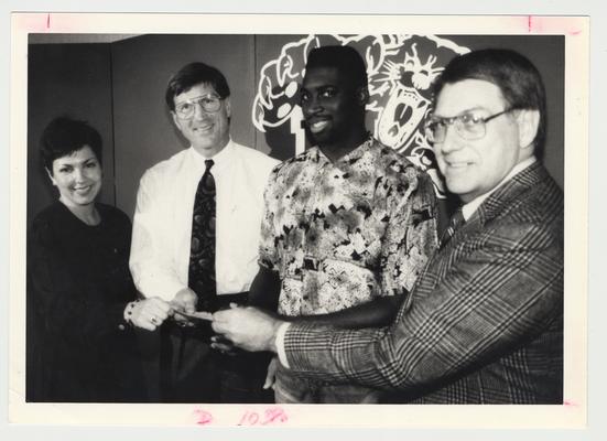 From the left:  Paula Pope, Coach Curry, Derrick Thomas, and Bob Slone