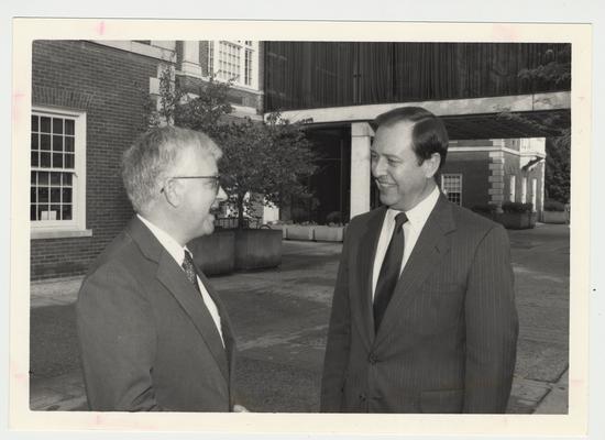 President Charles Wethington (right) is talking with Paul Willis (left), Director of Libraries, near M. I. King Library