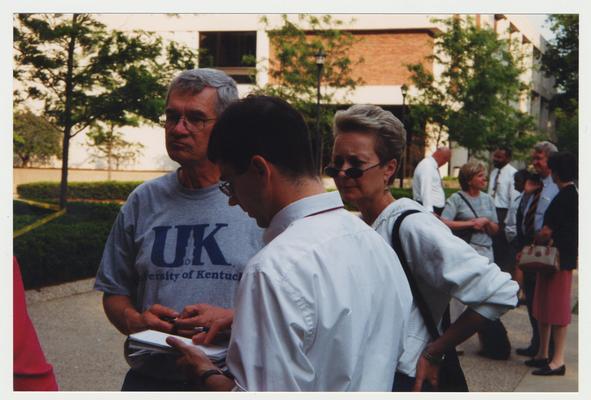 Frank Burch (on Left) and Sue Burch are standing near the Administration / Main Building during the fire