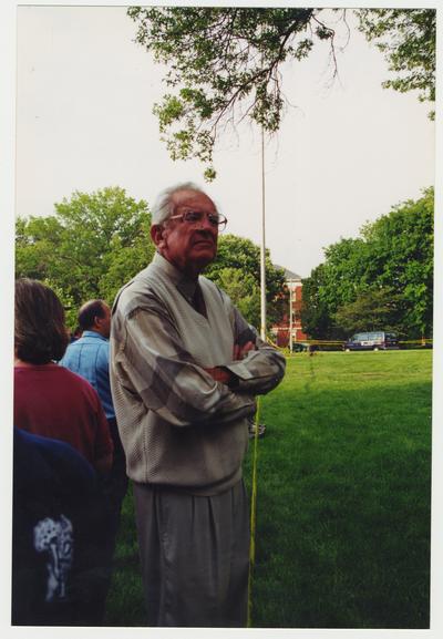 Former President Otis Singletary is looking at the Administration / Main Building after the fire