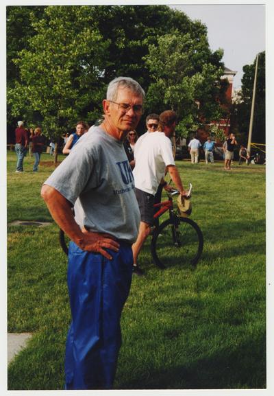 Frank Burch and others are gathered on the lawn of the Administration / Main Building