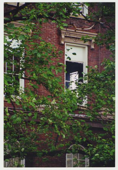 A close up of a window in the Administration / Main Building broken out during the fire