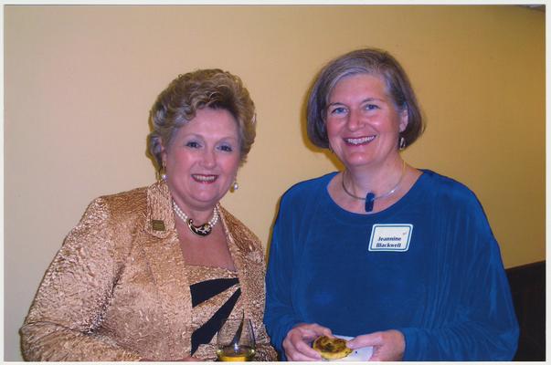 Patsy Todd (left) and Jeannine Blackwell are at a ceremony for the reopening of the Main Building