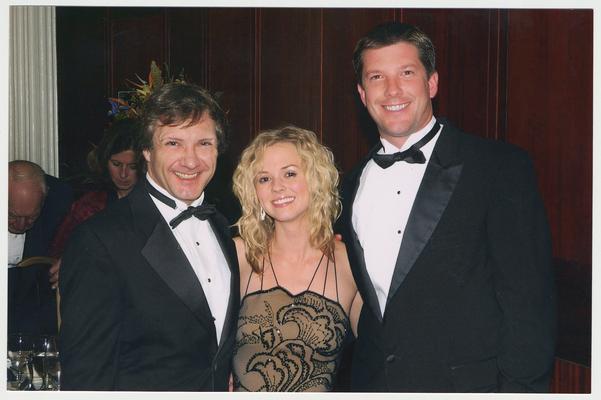 Kathryn Todd (center), the daughter of President Lee Todd and Patsy Todd, is with two unidentified men.  The man on the right is her escort