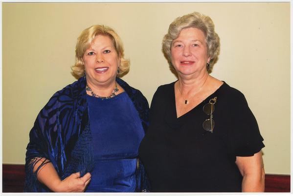 Myra Tobin (right), B.O.T., and Myra's sister (left) are at a ceremony for the reopening of the Main Building