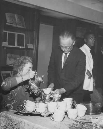 At the dedication of the King Annex, Helen King pouring for William Sherwood