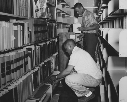 Two male students are moving items into or out of the Annex of the King Library. Received June 4, 1962 from Public Relations