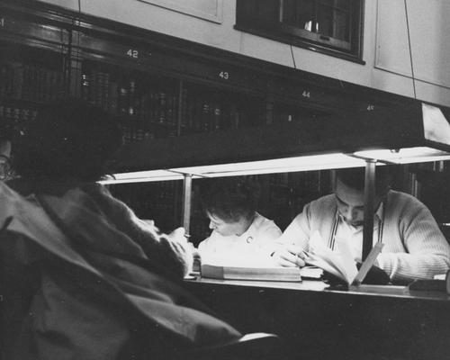 Students studying at night in the Breckinridge Room of King Library